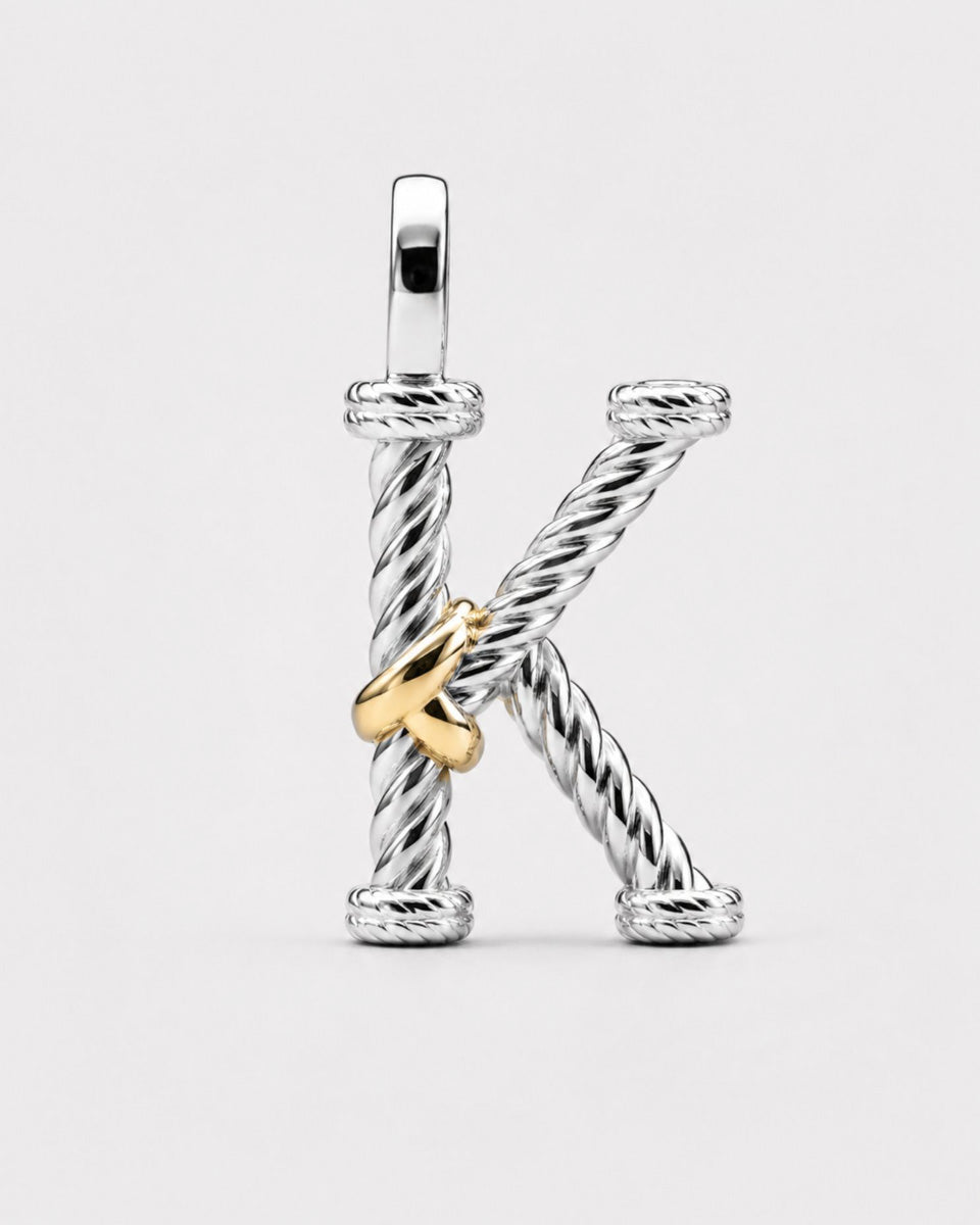 Срібна літера "K"